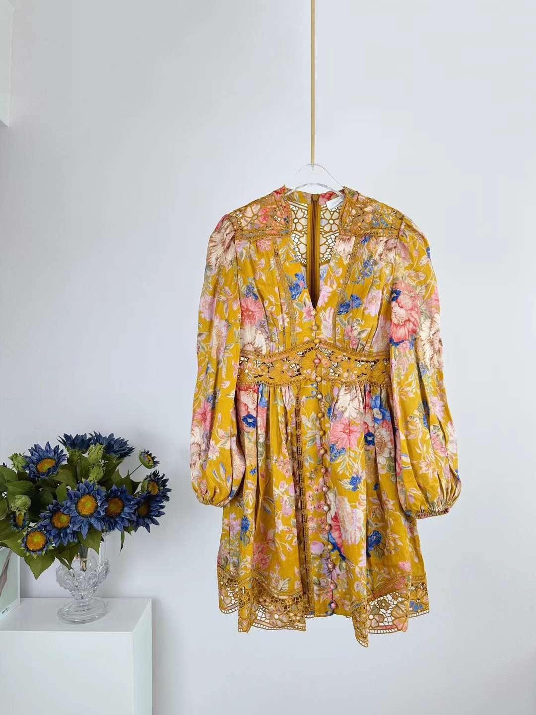 The August Plunge Mini Dress in Ivory and Mustard Floral from our Resort Swim 2024 Collection